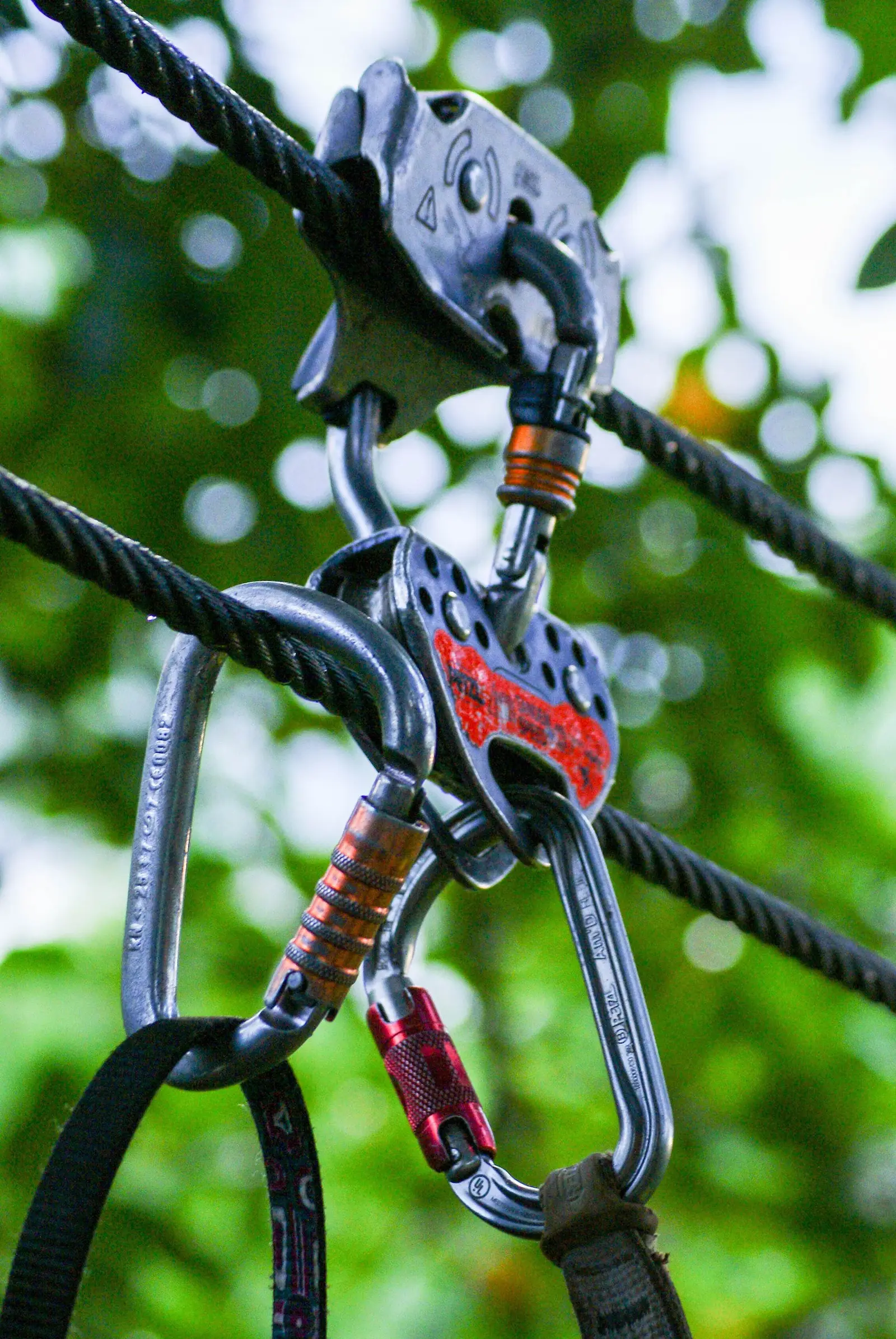 Zipline pulley and carabiners on the cable
